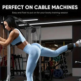 Woman using cable machine with ankle strap for leg exercise in gym, SportQ fitness equipment.