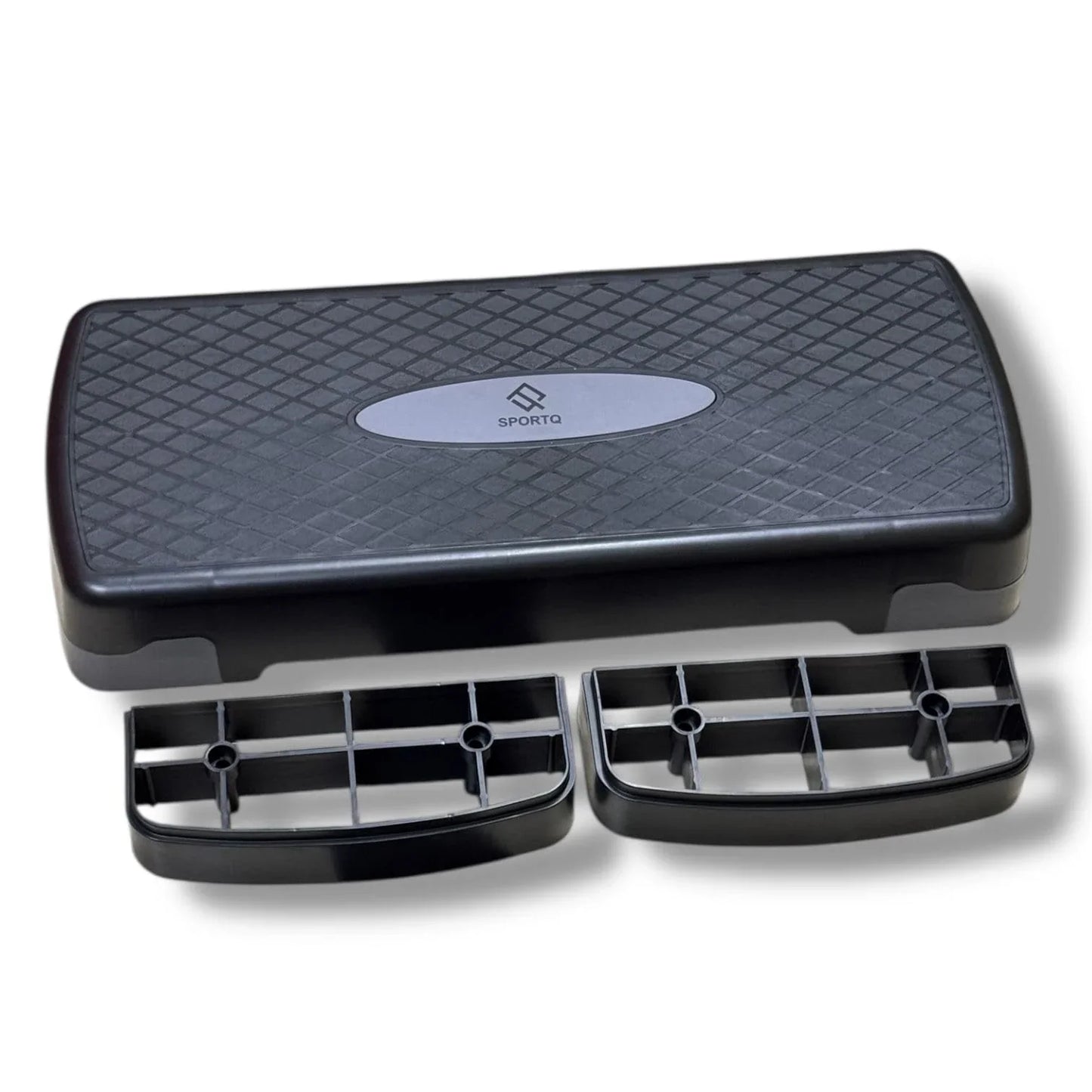 SportQ black aerobic stepper platform with risers, home gym workout equipment.